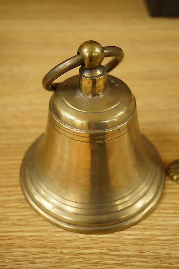 A brass bell with wall mount, 24cm high. Condition - good